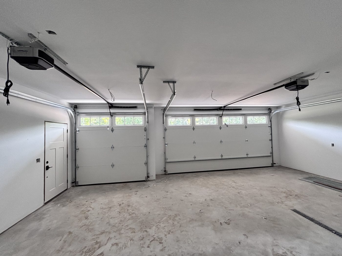 New garage doors and LiftMaster openers installed by Powell's Garage Door Services, interior view